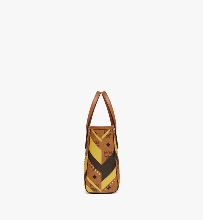 Studded Toni Top-Zip Shopper in Mega Herringbone Visetos Studded Toni Top-Zip Shopper in Mega Herringbone Visetos